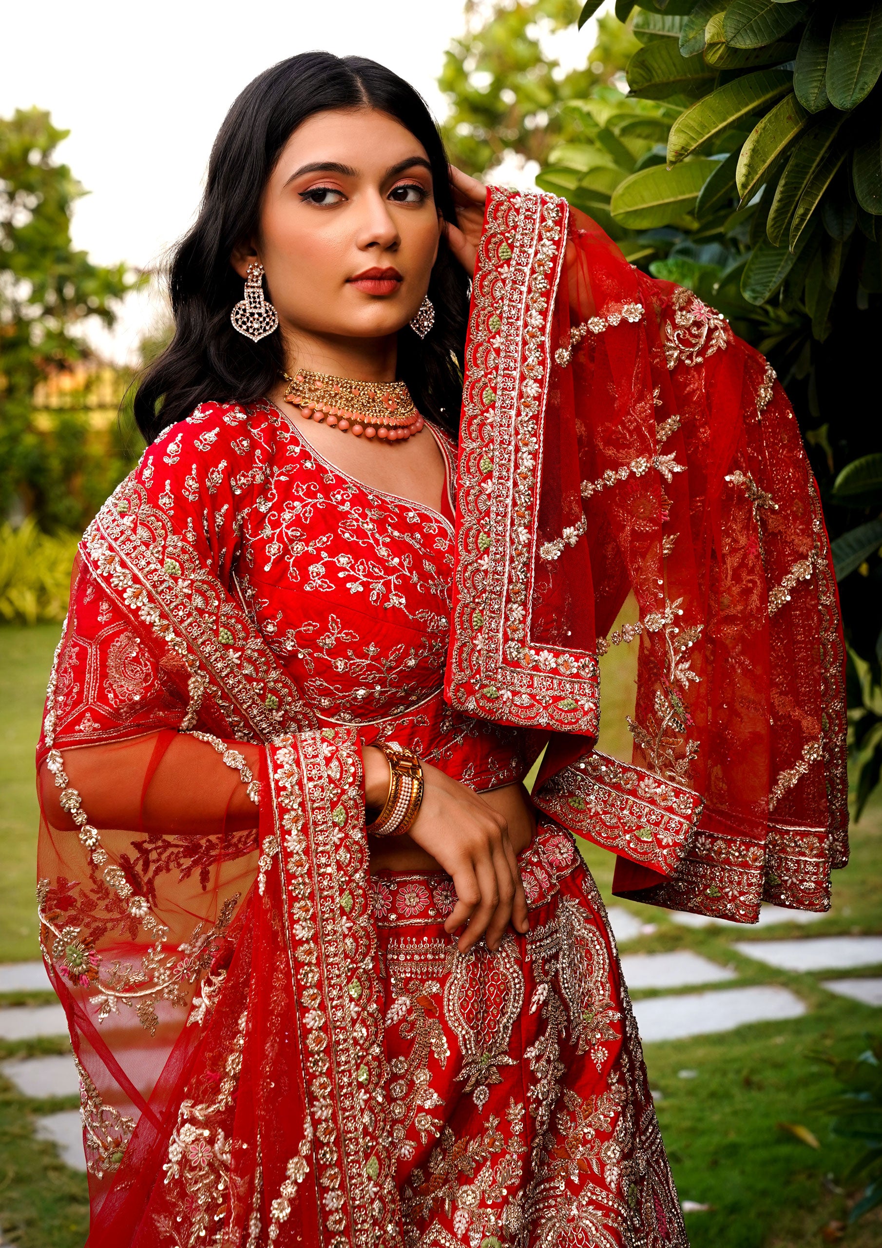 Beautiful red wedding lehenga choli with exquisite designs, showcasing traditional bridal attire for a memorable occasion.