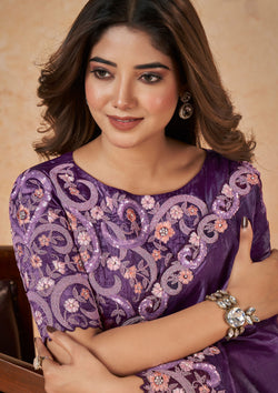  Elegant purple saree adorned with floral designs.