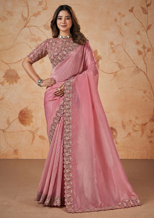 Elegant pink silk saree adorned with beautiful embroidery details.
