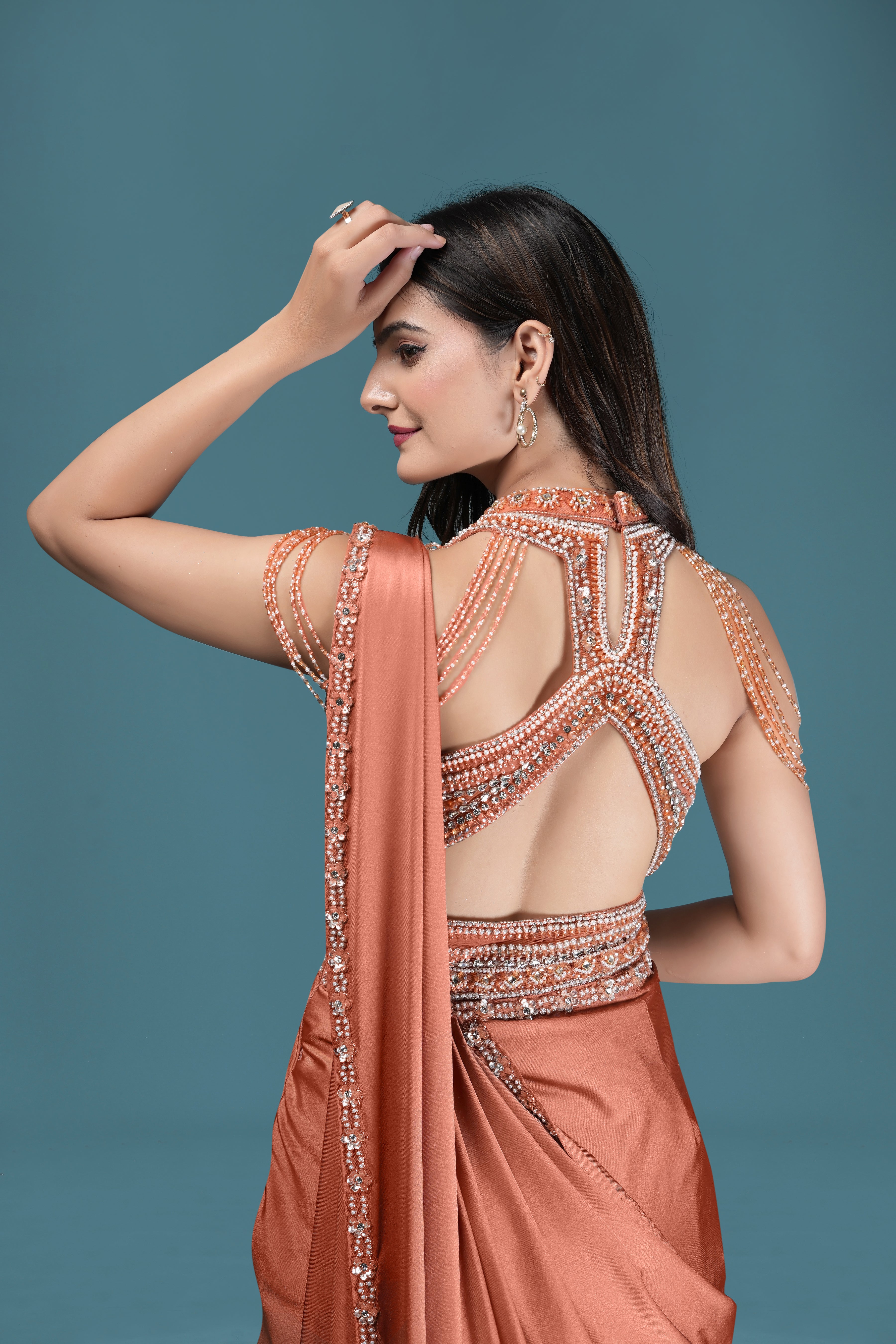 Pastel Peach Drape Saree with Crystal Embellished Designer Blouse