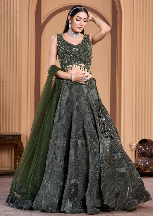 Green embroidered lehenga choli with intricate floral patterns, perfect for traditional Indian weddings.