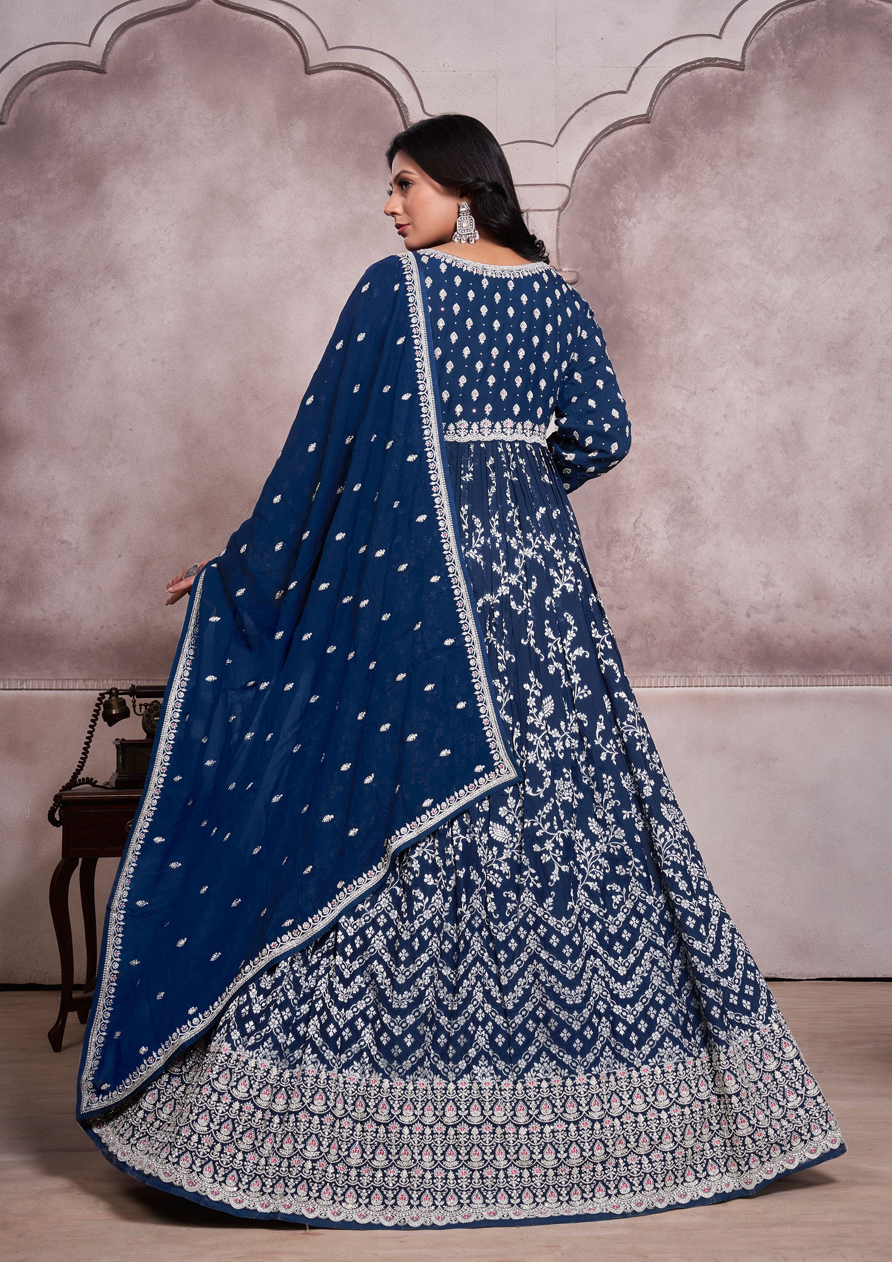 Blue embroidered anarkali suit with intricate patterns and elegant design, perfect for special occasions.