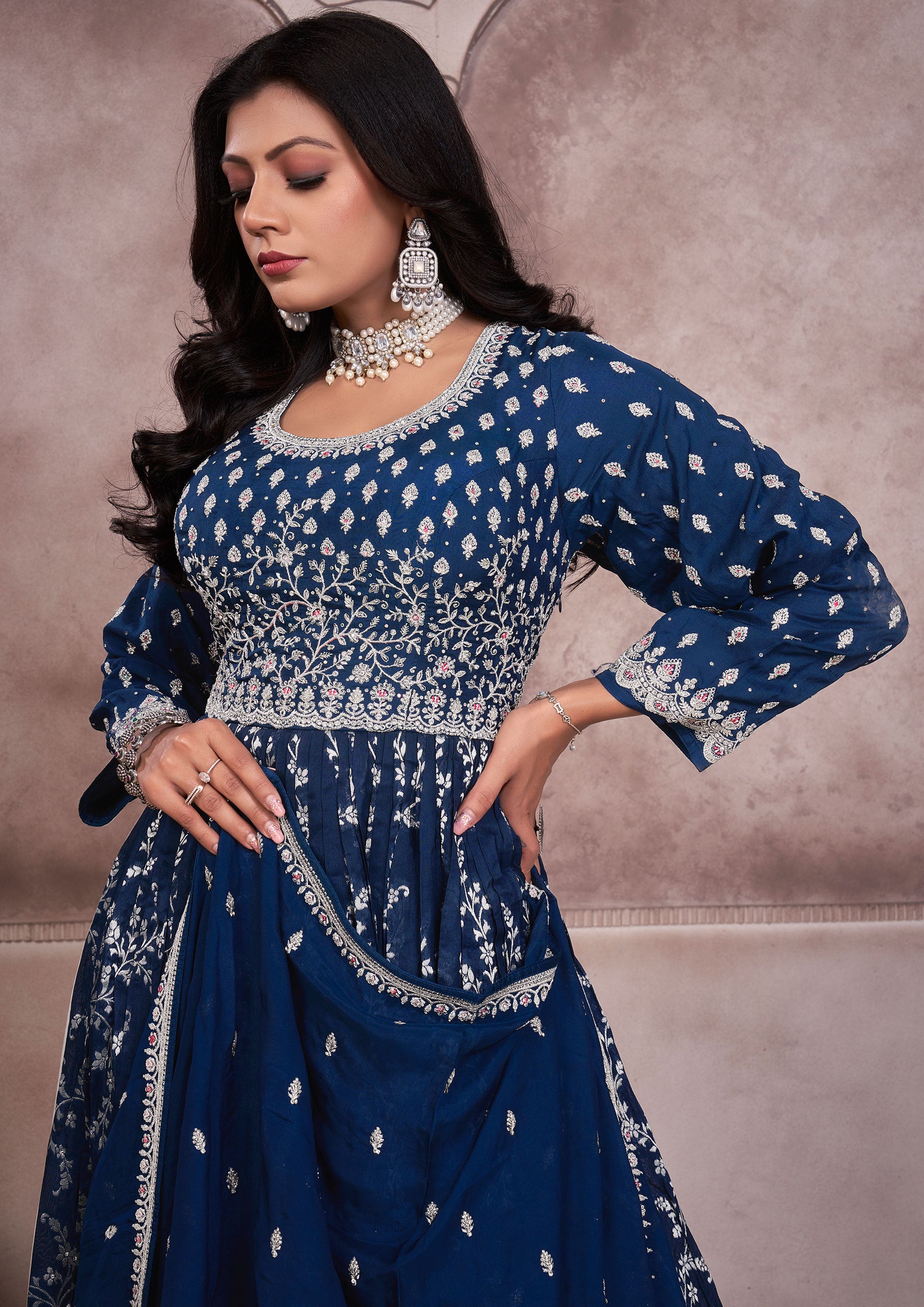 Blue embroidered anarkali suit with intricate patterns and elegant design, perfect for special occasions.