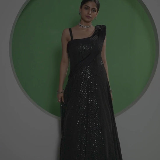 Black sequin gown with one shoulder, perfect for a glamorous evening event.